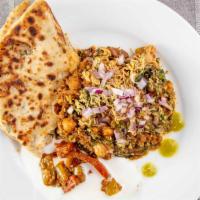 Samosa Chaat · Vegan. Two pieces. Crunchy samosas topped with chole and chaat toppings. Chaat toppings incl...