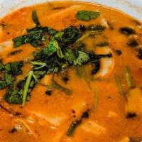 Lemon-Grass Soup (Tom Yum) · The most popular spicy clear soup, made with Thai herbs (lemongrass, lime leaves, galangal),...