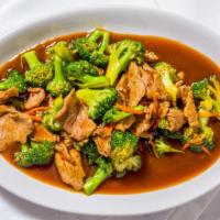 Pad Broccoli · Stir-fried broccoli, mushrooms, carrots, and ginger in Thai style gravy with your choice of ...