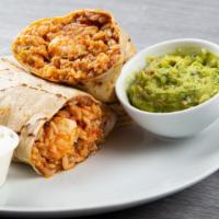 Shrimp Burrito · Burrito filled with shrimp, green peppers, onions, tomatoes and topped with nacho sauce. Ser...