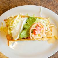 Taco Salad · Crispy flour shell with your choice of ground beef or shredded chicken, beans, tomatoes, che...
