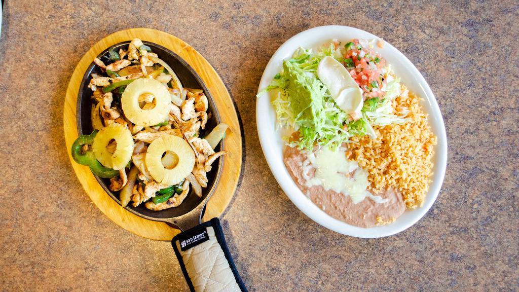 Fajitas Hawaiians · Sautéed onion, bell pepper, and pineapple, served with rice, guacamole salad, and your choice of meat.