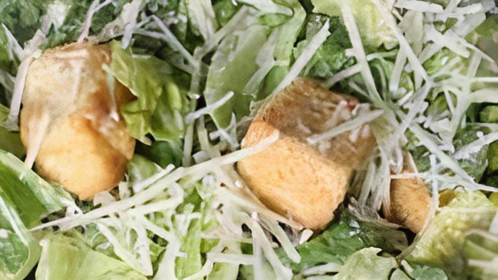 Chicken Caesar Salad · Chopped romaine lettuce, tossed in traditional Caesar dressing, croutons and shredded Parmesan Cheese. Topped with grilled chicken.