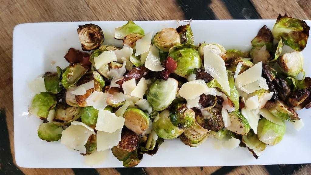 Brussel Sprouts · Hickory smoked bacon, bourbon onions, truffle oil, parmesan.