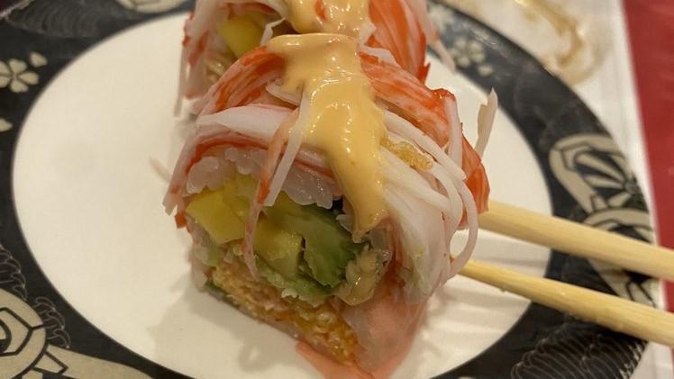 Omaha Roll · Spicy lobster, cucumber, avocado mango soy paper crab on top.