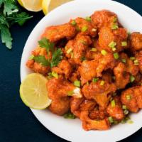 Gobi Manchurian · Cauliflower stir-fried in sweet and spicy sauce, served dry or with gravy.