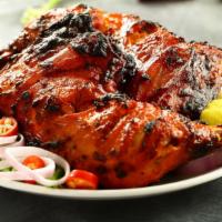Blackned Tandoori Chicken (Half) · Chicken tandoori half. Chicken leg and thigh pieces are marinated overnight in yogurt with h...