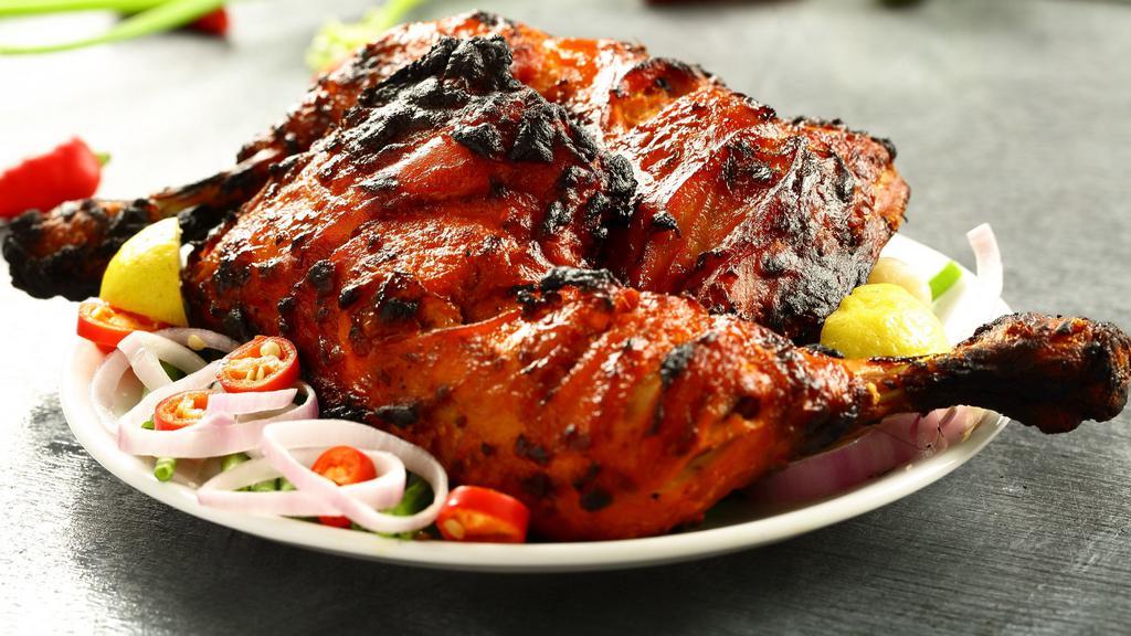 Blackned Tandoori Chicken (Half) · Chicken tandoori half. Chicken leg and thigh pieces are marinated overnight in yogurt with herbs and spices and cooked on skewers in tandoor.