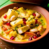 Navratan Kurma · Mixed vegetables cooked with cottage cheese, cashews, raisins, turmeric and fenugreek leaves...