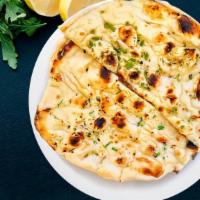 Butter Naan · Leavened white bread baked in tandoor oven with butter.