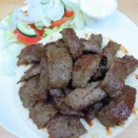 Gyro · Lamb and beef broiled on a rotisserie served in pita bread with your choice of our famous cu...