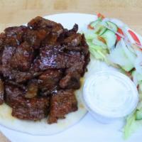 Bbq Gyro · Lamb and beef broiled on a rotisserie served in pita bread with your choice of our famous cu...