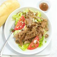 Gyro Salad · Greek salad topped with gyro meat.