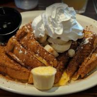 Texas Style French Toast · Texas toast dipped in our special Grand Marnier and orange-honey batter.  Sprinkled with cin...