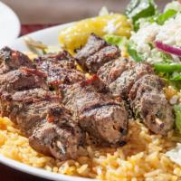 Lamb Skewers (Souvlaki) Dinner · Three char-grilled lamb skewers over rice with a Greek salad. Served with pita bread.