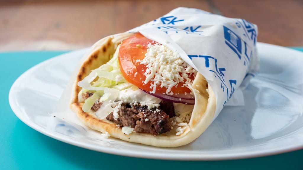 Pita Burger · Feta cheese, lettuce, tomatoes, onions and tzatziki.