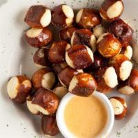 Pretzel Bites · Soft pretzel bites served with homemade fondue cheese sauce