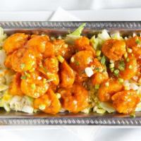 Battered Shrimp · Battered shrimp tossed in spicy Sriracha aioli, green onions, iceberg lettuce