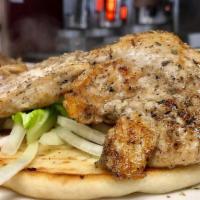 Grilled Chicken Pita · Grilled and char-broiled chicken breast served on pita bread with lettuce, tomato, and tzatz...