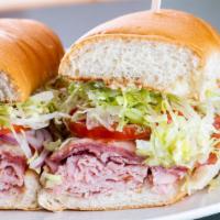 Assorted Hoagie · Ham and salami on a garlic toasted white or wheat hoagie bun. Topped with lettuce, tomato, o...