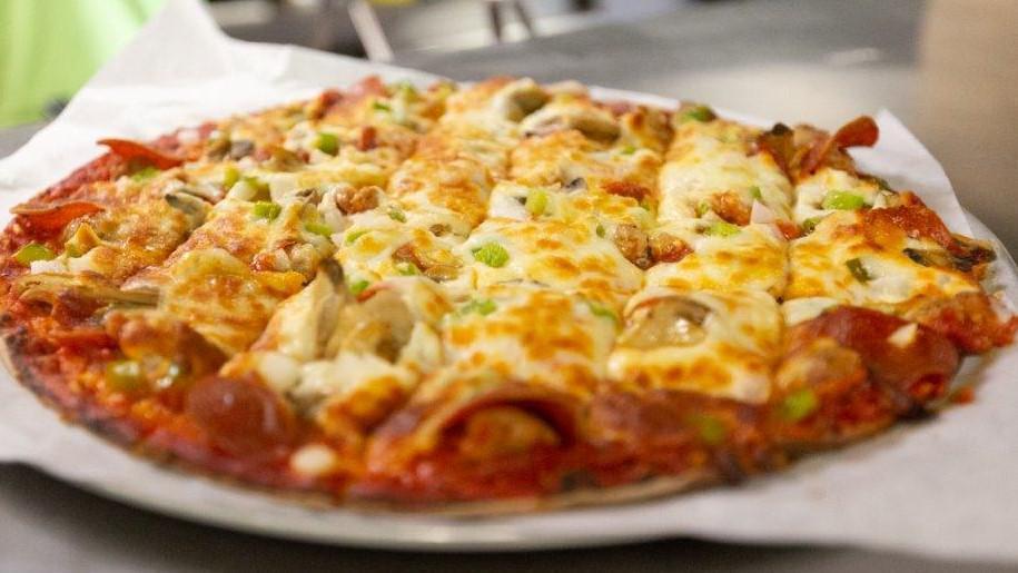 House Special · Pizza Sauce, Mozzarella, Sausage, Pepperoni, Mushrooms, Green peppers & Onions.