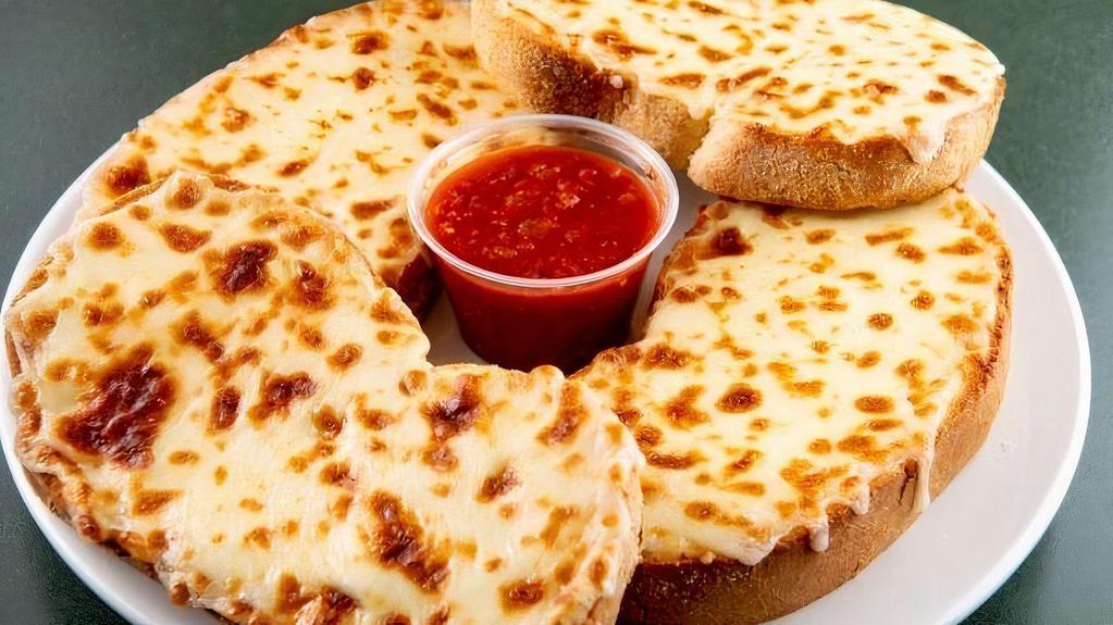 Cheese Bread · Garlic bread smothered with mozzarella cheese. Served with marinara sauce.