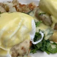 Salmon Benedict · Two poached eggs and sautéed spinach. Served on an English muffin with Hollandaise sauce or ...