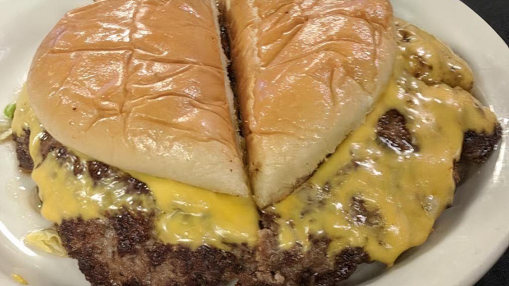 Big Daddy (1/2 Lb) · Enterprisemmmm, heaven on a bun! Ron's legendary giant 1/2 lb. cheeseburger with the onions fried into the meat. Buns dressed with mustard, pickle, lettuce, tomatoes and raw onions. Please tell us if you don't want cheese.