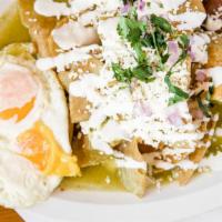 Chilaquiles · Popular Mexican breakfast served with two eggs, fried tortillas chips, covered in a mild gre...