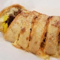 Meatball Stromboli · Meatballs, green and red peppers, onions, banana peppers, 4 blend cheese, pizza sauce and a ...
