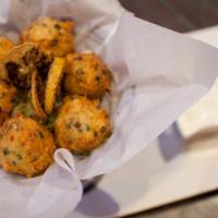 Accras (Cod Fish Cakes) · Salted cod fish, mixed with herbs, spices and chili pepper, deep fried until light, crispy a...