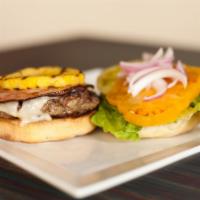 Sisserou’S Burger · Our signature burger grilled to order topped with ham, grilled pineapple, Swiss cheese, lett...