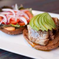 Ahi Burger · Fresh ahi grade tuna grilled rare, sliced and topped with a mildly spicy apricot glaze, lett...
