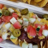 Nachos Supreme · Whole tortilla chips, covered with chili and Nacho cheese, and served with your choice of co...