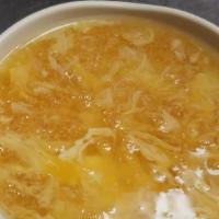 Egg Drop Soup · Contains chicken, tofu, water chestnuts and bamboo in a savory yellow egg-broth.