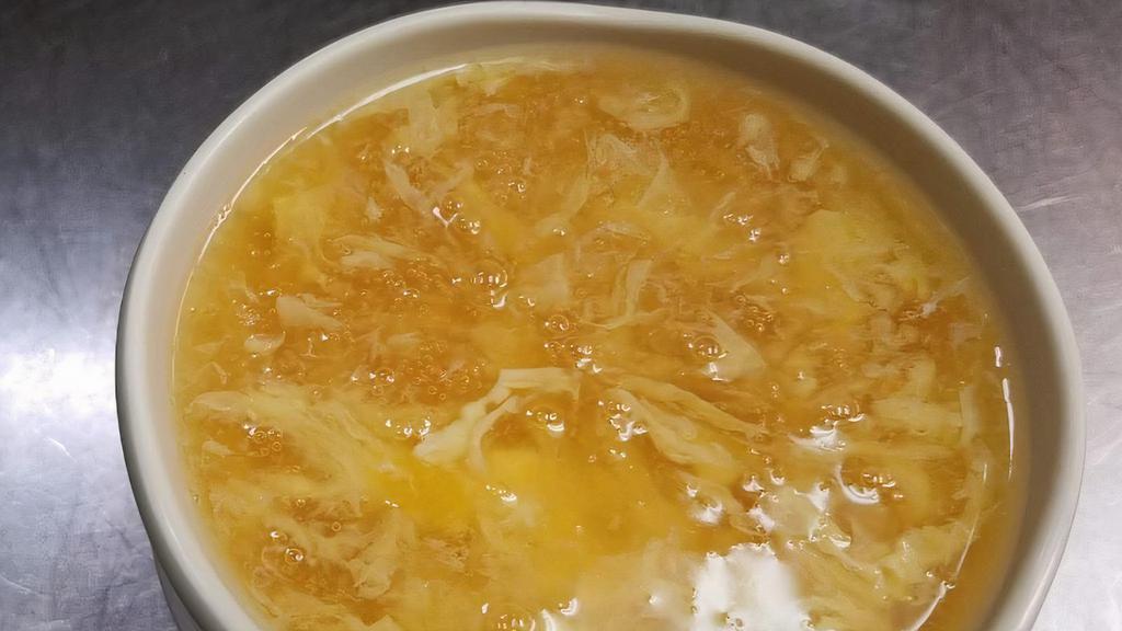 Egg Drop Soup · Contains chicken, tofu, water chestnuts and bamboo in a savory yellow egg-broth.