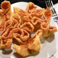 Crab Rangoon (6) · 6 pieces. Wonton wrapper folded star shaped with savory cream cheese mixed with small bits o...