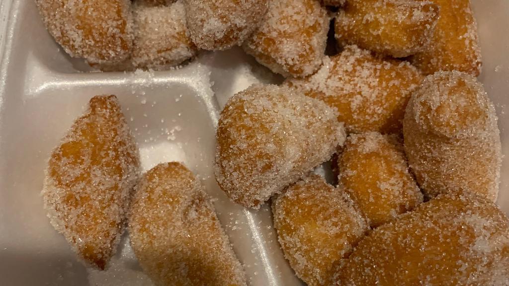 Sugar Donut · Chewy golden brown fried donut balls tossed in sweet sugar.