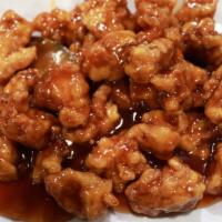 General Tso'S Chicken (D) (W/Steam White Rice) · Chunks of batter fried chicken in a thick savory sweet brown sauce with large dry spicy chil...