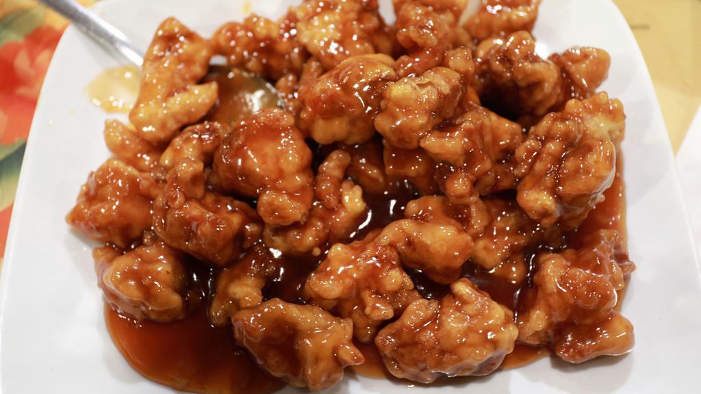 General Tso'S Chicken (D) (W/Steam White Rice) · Chunks of batter fried chicken in a thick savory sweet brown sauce with large dry spicy chili peppers.