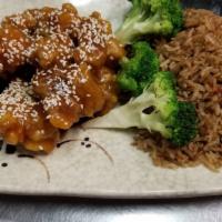 Sesame Chicken (Deep Fried) (D) (W/Steam White Rice) · Chunks of batter fried chicken in a thick savory sweet brown sauce with large dry spicy chil...