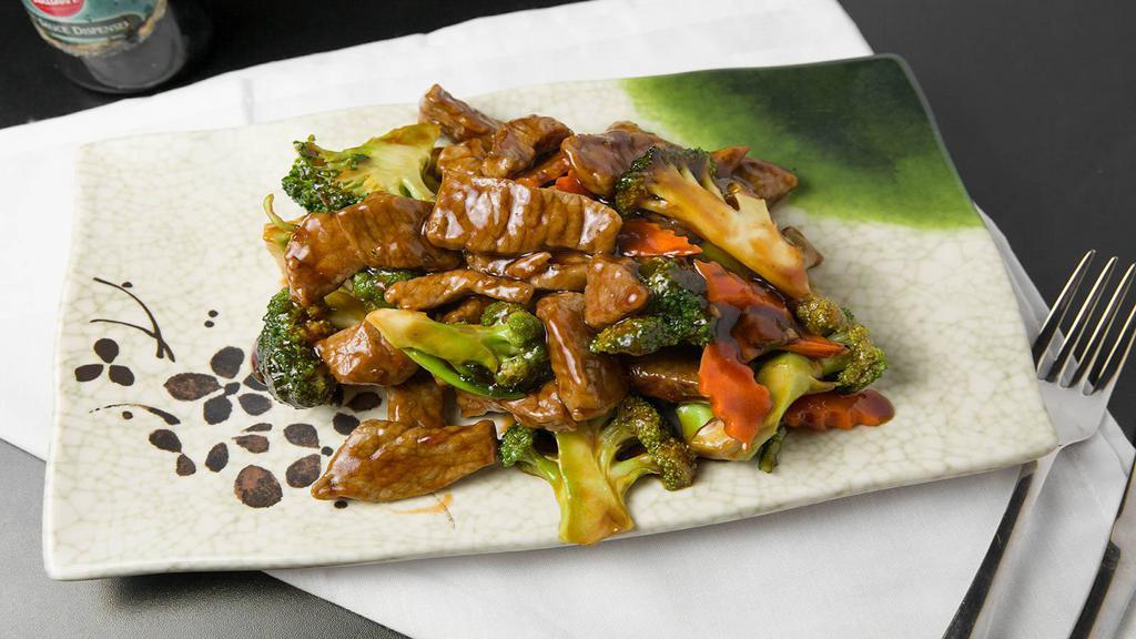 Beef With Broccoli (D) (W/Steam White Rice) · Slices of beef in a savory brown sauce with broccoli.