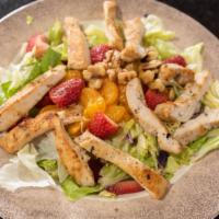 Strawberry Chicken Salad · Crisp romaine and Iceberg Lettuce Topped with Strawberries, Walnuts, Mandarin Oranges served...