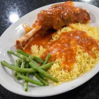 Lamb & Rice · Generously portioned shank stewed in our tomato sauce. Served with Rice Pilaf and Green Beens