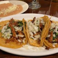 Mexican Style 3 Tacos · Cilantro, onions and lemon. Served with rice or beans. Carnitas, chicken, al pastor, asada, ...