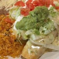 Chimichangas Supreme · Two flour tortillas rolled up and stuffed with shredded beef, pork or chicken, then covered ...