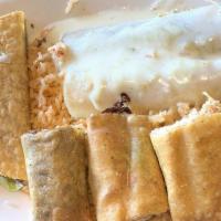 Manuel'S Combo · Two chicken taquitos Mexicanos and one chicken enchilada. Topped with onions and cheese sauc...