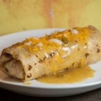 Steak Burrito · With lettuce, cheese, sour cream, tomato, rice and beans. (Everything Inside).