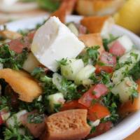 Fattoush Salad · Chopped tomatoes, lettuce, cucumber, parsley, feta cheese and olives. Mixed with lemon juice...