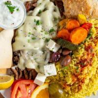 Gyros Platter (Beef & Lamb) · Grilled slices of gyros meat topped with swiss cheese. Served with tomatoes, onions, kalamat...